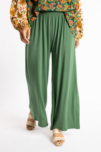Sophie is wearing S/M Wide Leg Pants in Olive green