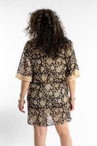 Susan is wearing the one size Kala Printed Cover Up in Black