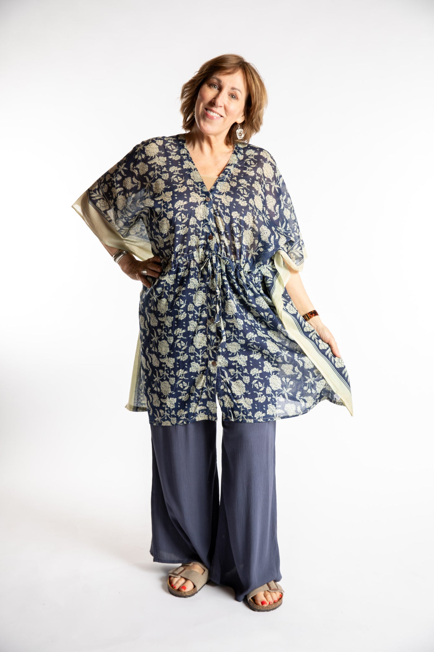 Betty is wearing the one size Kala Printed Cover Up in Blue
