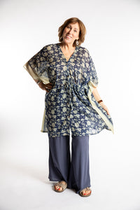 Betty is wearing the one size Kala Printed Cover Up in Blue
