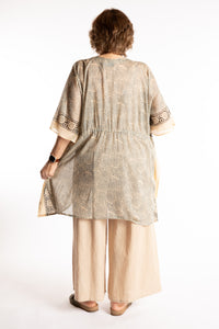 Betty is wearing the one size Kala Printed Cover Up in Gray