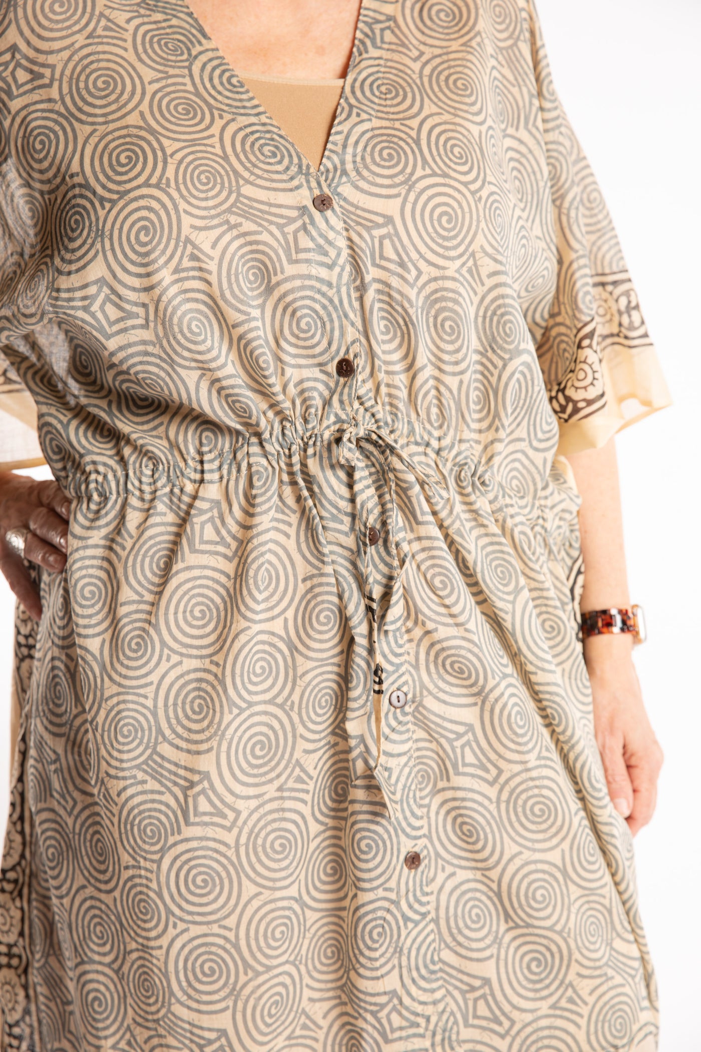 Betty is wearing the one size Kala Printed Cover Up in Gray