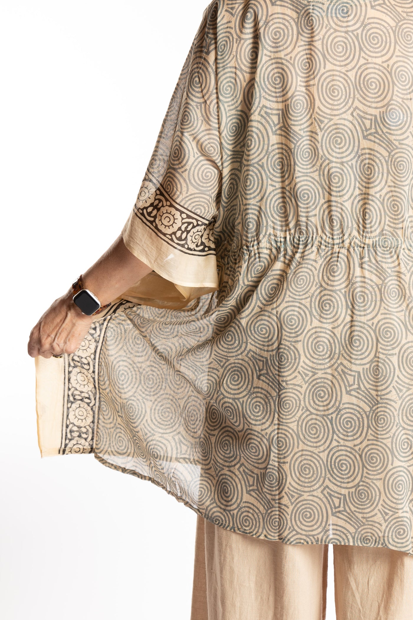 Betty is wearing the one size Kala Printed Cover Up in Gray
