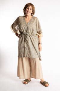 Betty is wearing the one size Kala Printed Cover Up in Gray
