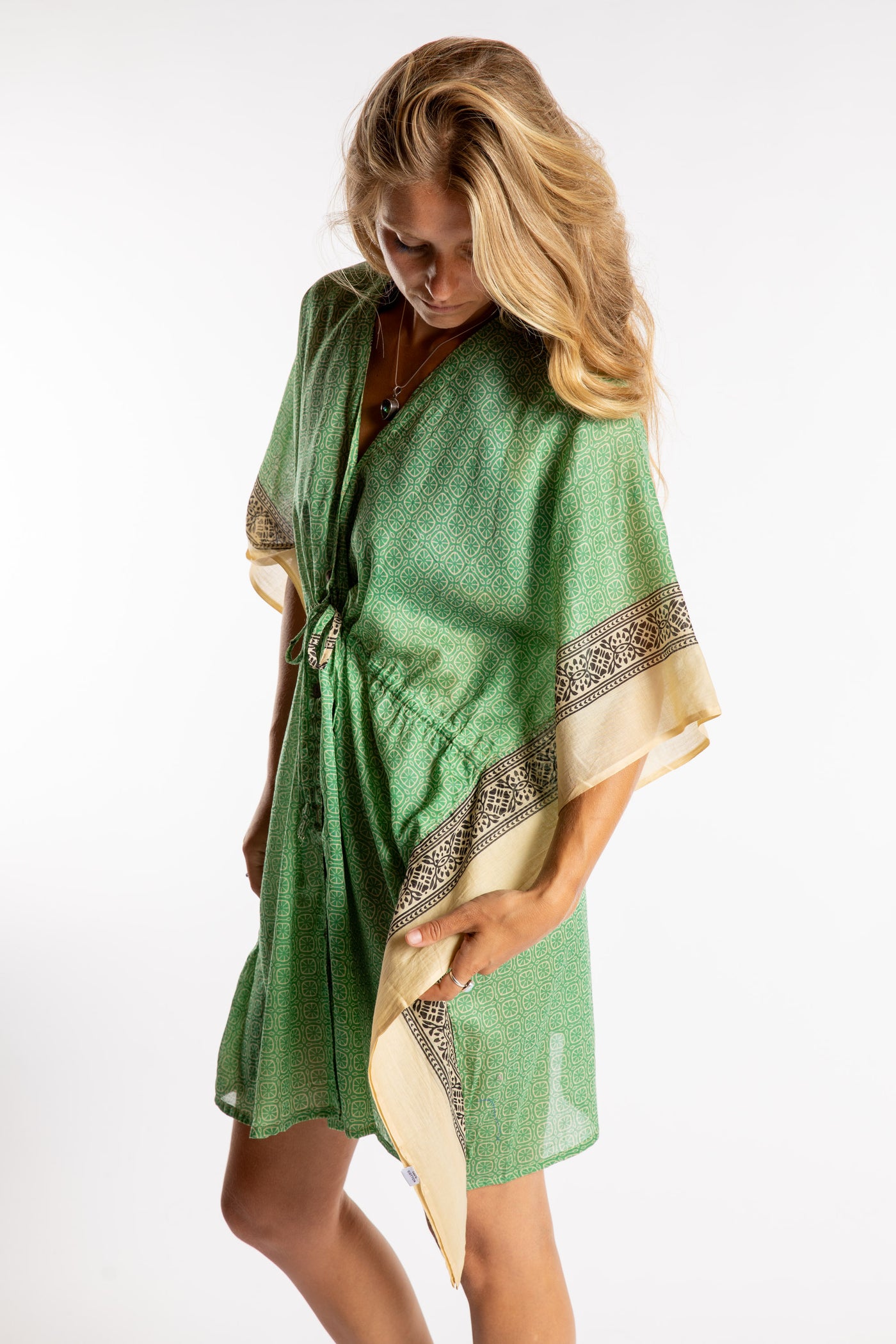 Sophie is wearing the one size Kala Printed Cover Up in Green