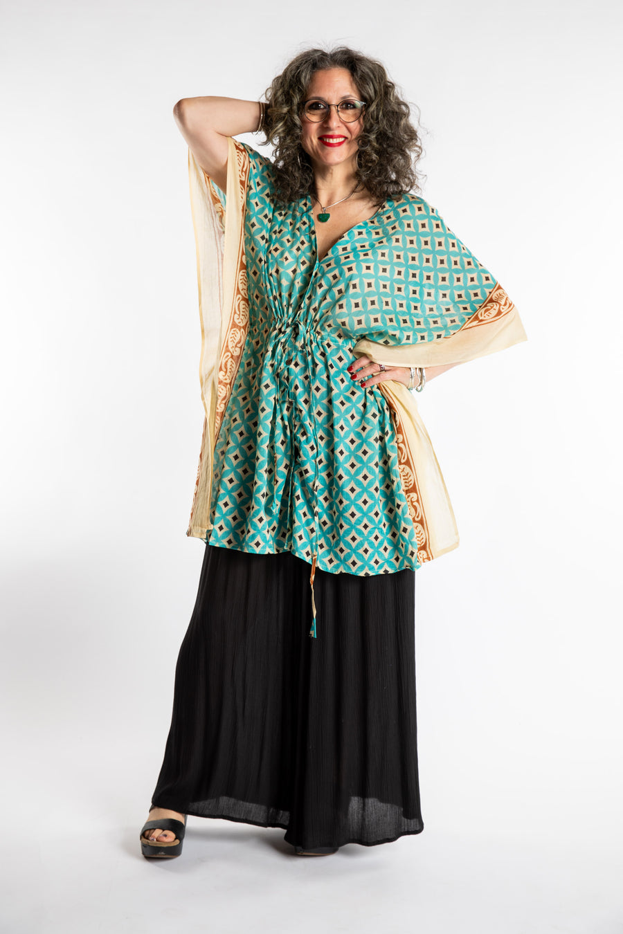 Susan is wearing the one size Kala Printed Cover Up in Teal