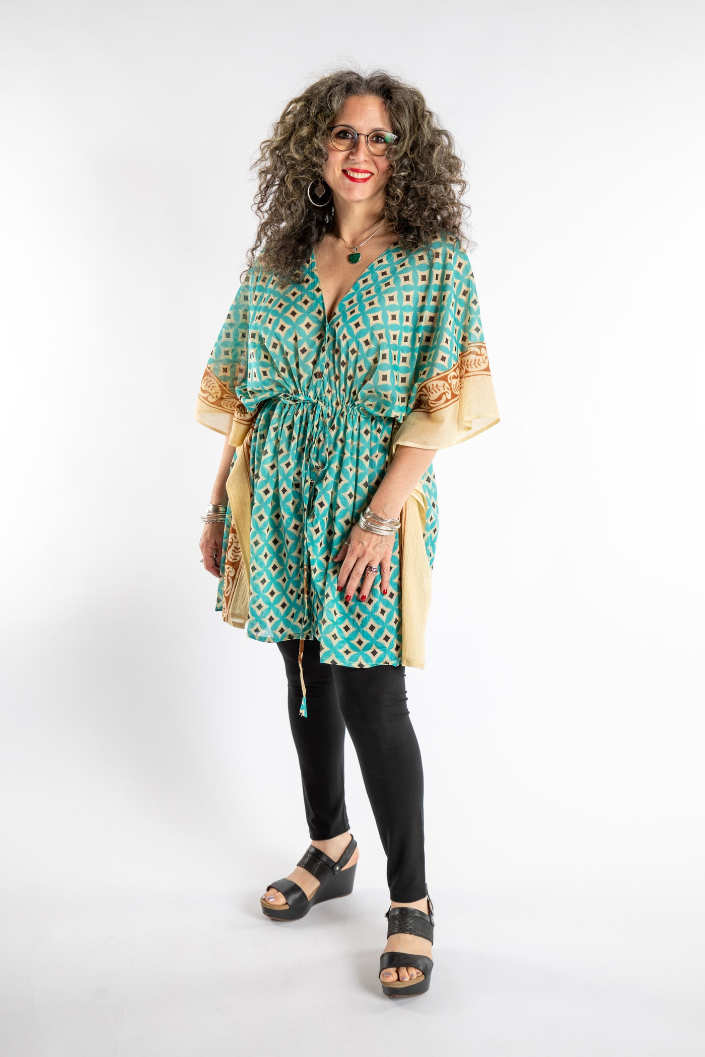 Susan is wearing the one size Kala Printed Cover Up in Teal