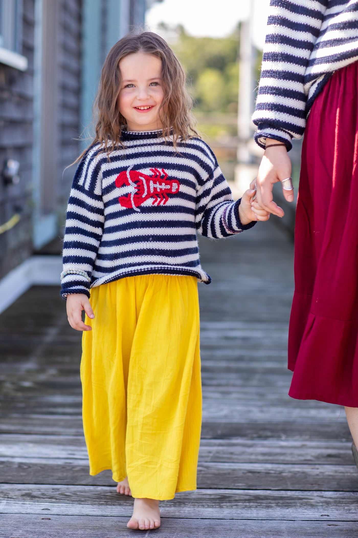 Lilly is wearing a kids lobster sweater