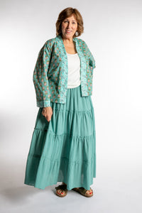Betty is wearing the one size Kiraana cardigan in Aquamarine