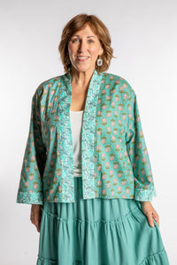 Betty is wearing the one size Kiraana cardigan in Aquamarine