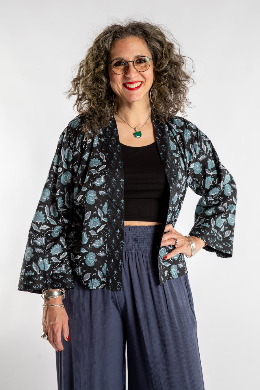 Susan is wearing the one size Kiraana cardigan in Black