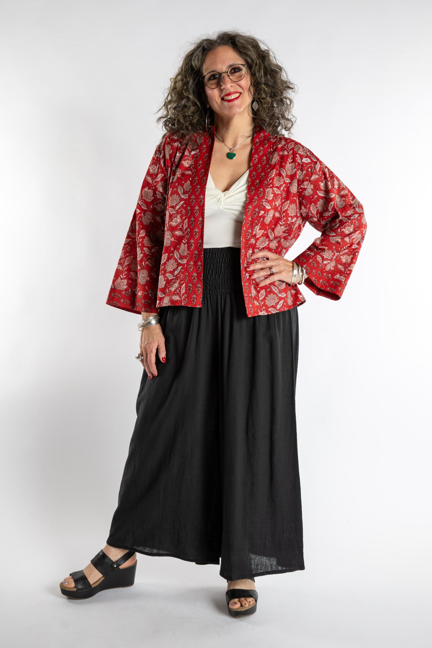 Susan is wearing the one size Kiraana cardigan in Red