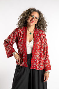 Susan is wearing the one size Kiraana cardigan in Red