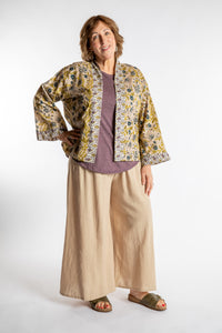 Betty is wearing the one size Kiraana cardigan in Tan