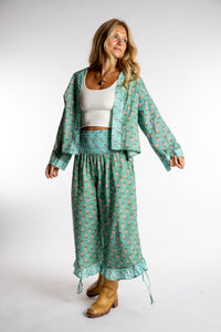 Sophie is wearing the Kiraana Tonal Crop Pants in Aquamarine S/M