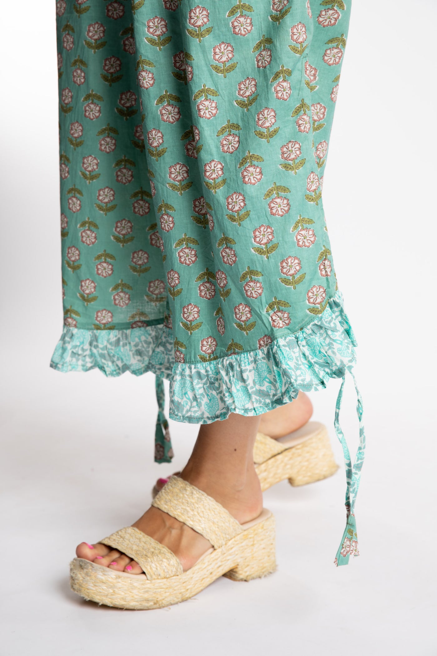 Sophie is wearing the Kiraana Tonal Crop Pants in Aquamarine S/M