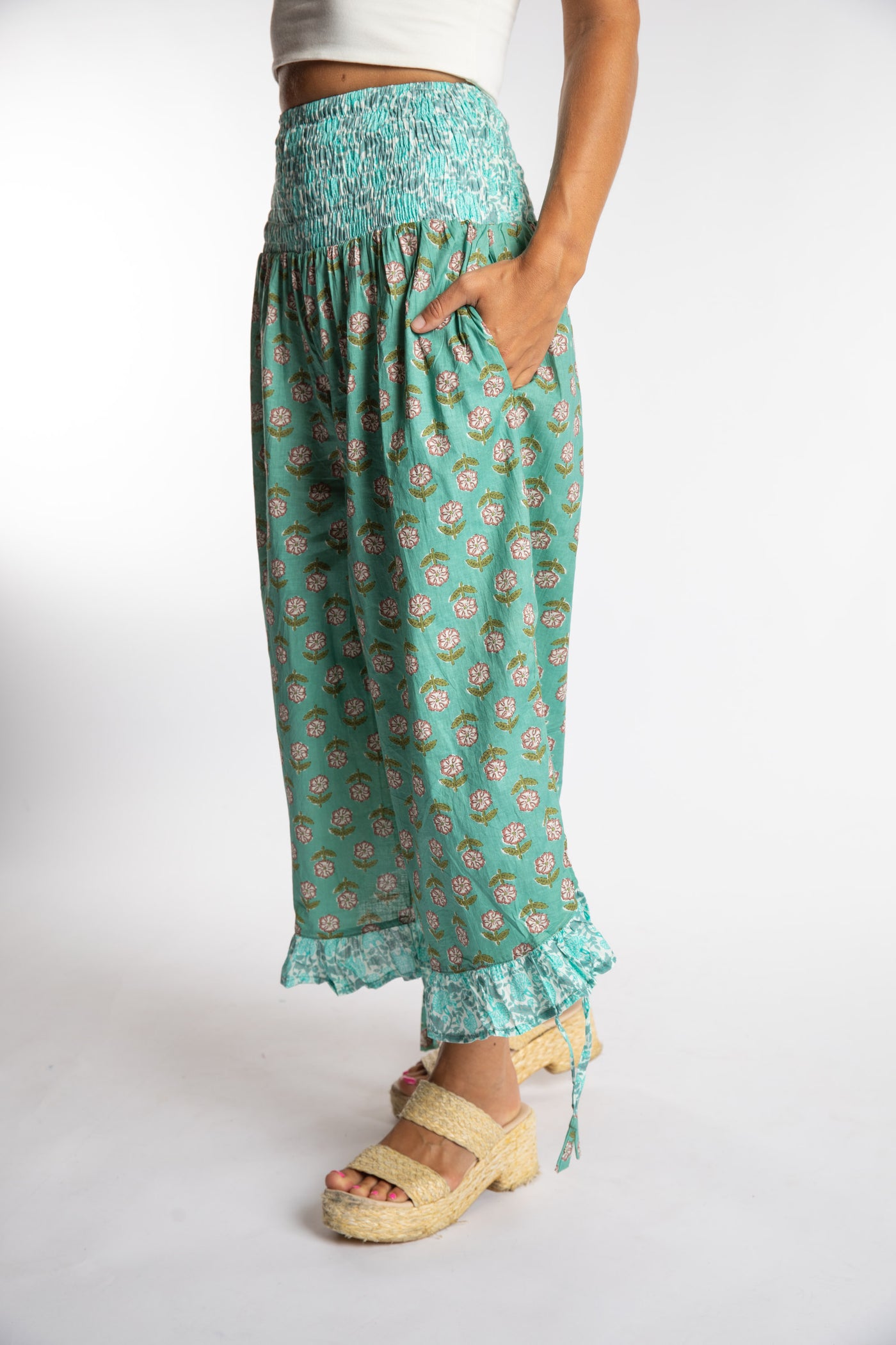 Sophie is wearing the Kiraana Tonal Crop Pants in Aquamarine S/M
