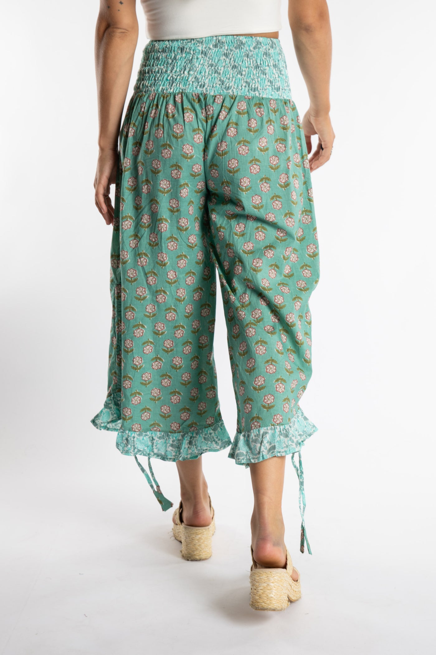 Sophie is wearing the Kiraana Tonal Crop Pants in Aquamarine S/M