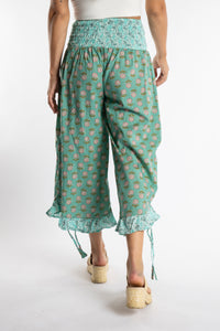 Sophie is wearing the Kiraana Tonal Crop Pants in Aquamarine S/M