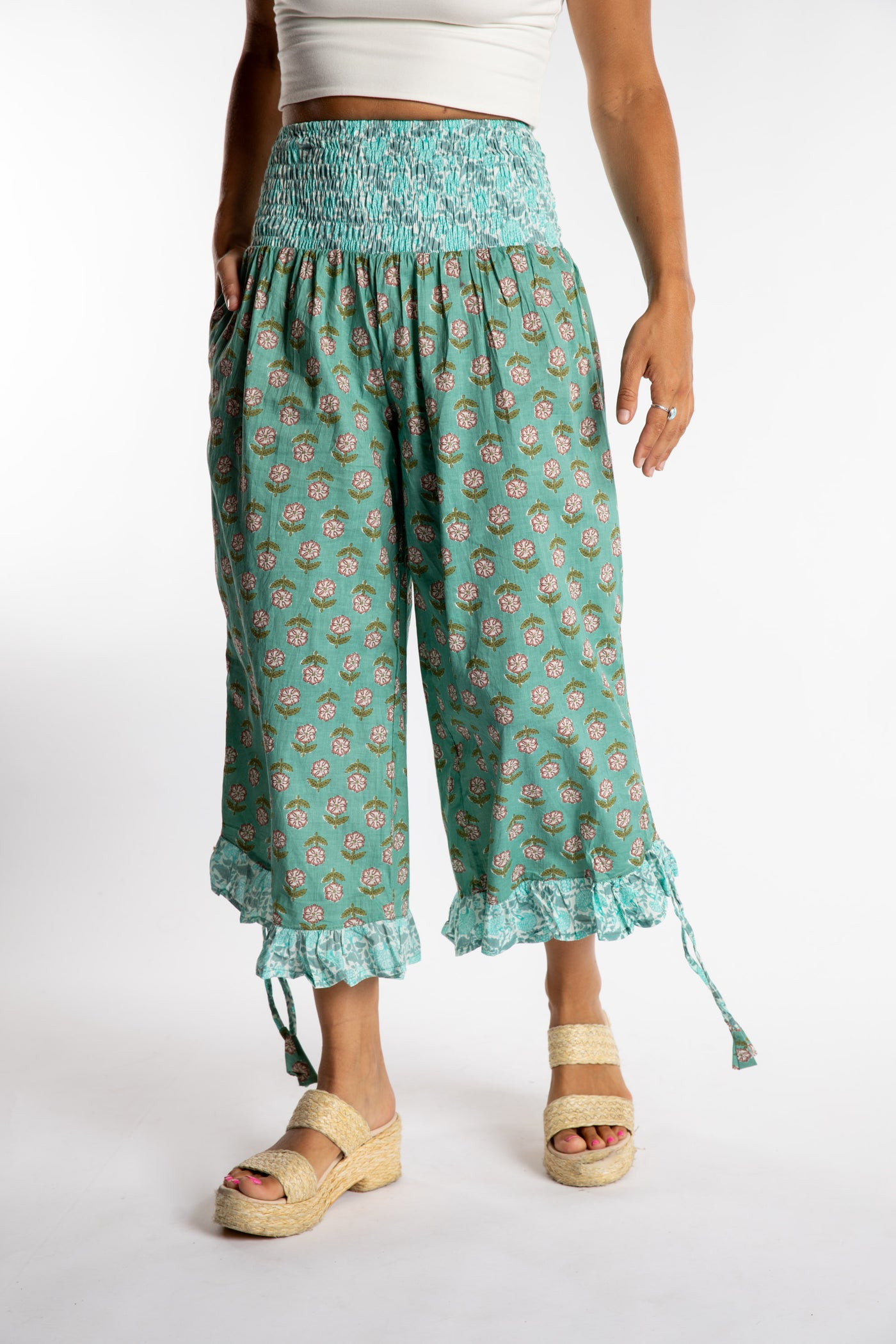 Sophie is wearing the Kiraana Tonal Crop Pants in Aquamarine S/M