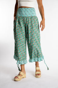 Sophie is wearing the Kiraana Tonal Crop Pants in Aquamarine S/M