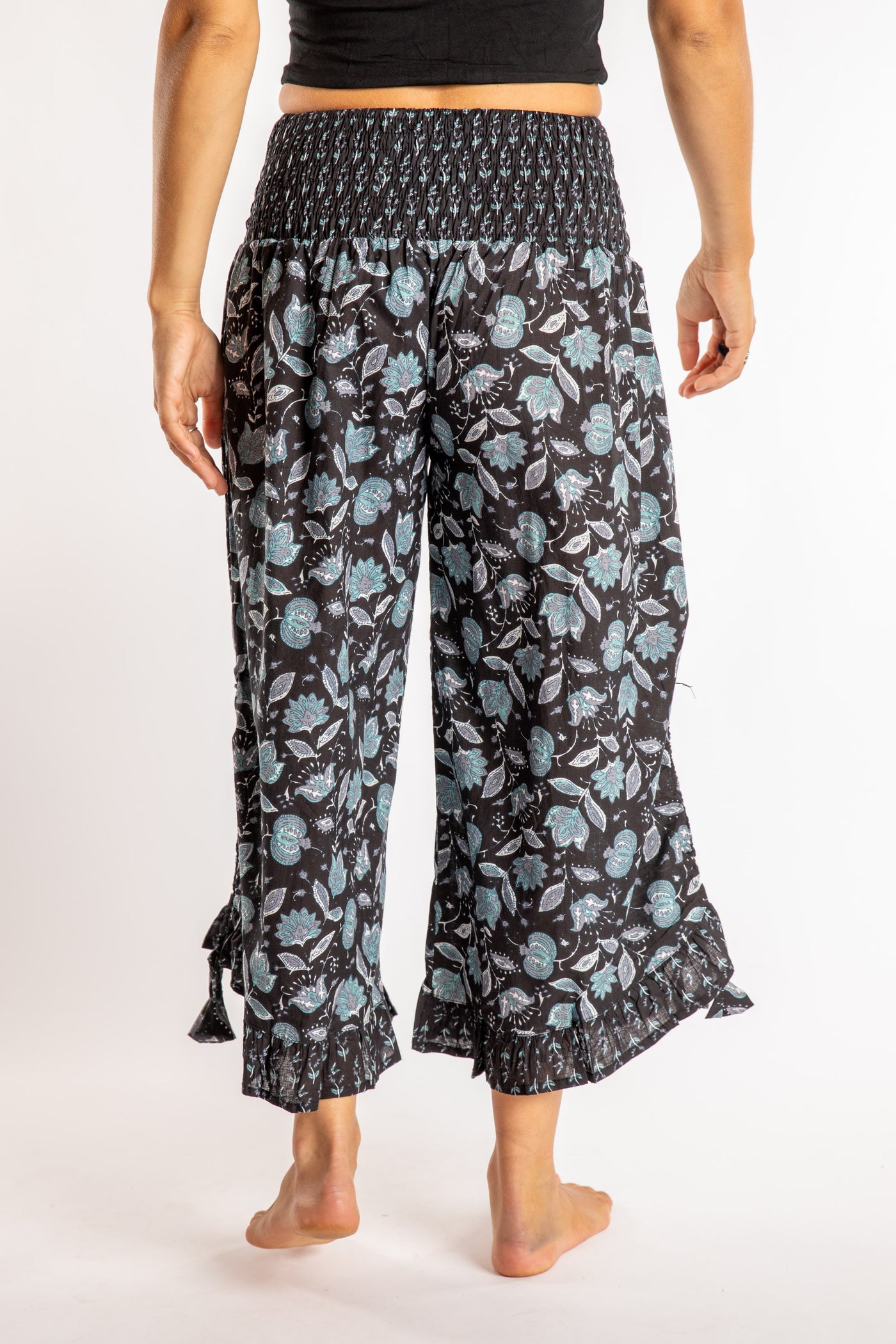 Sophie is wearing the Kiraana Tonal Crop Pants in Black S/M