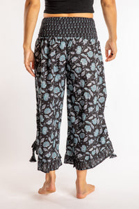 Sophie is wearing the Kiraana Tonal Crop Pants in Black S/M