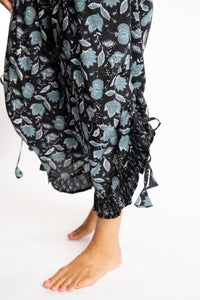 Sophie is wearing the Kiraana Tonal Crop Pants in Black S/M