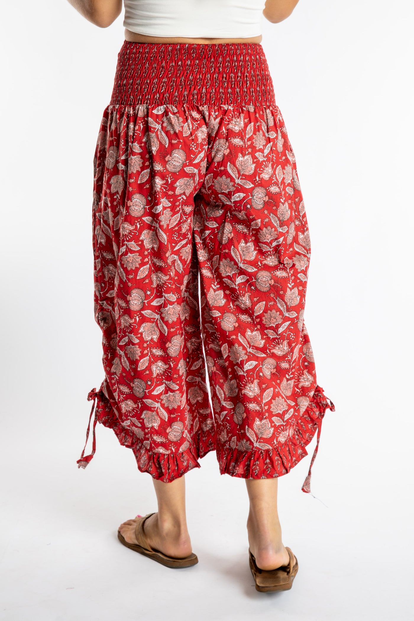 Sophie is wearing the Kiraana Tonal Crop Pants in Red S/M
