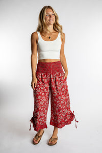 Sophie is wearing the Kiraana Tonal Crop Pants in Red S/M