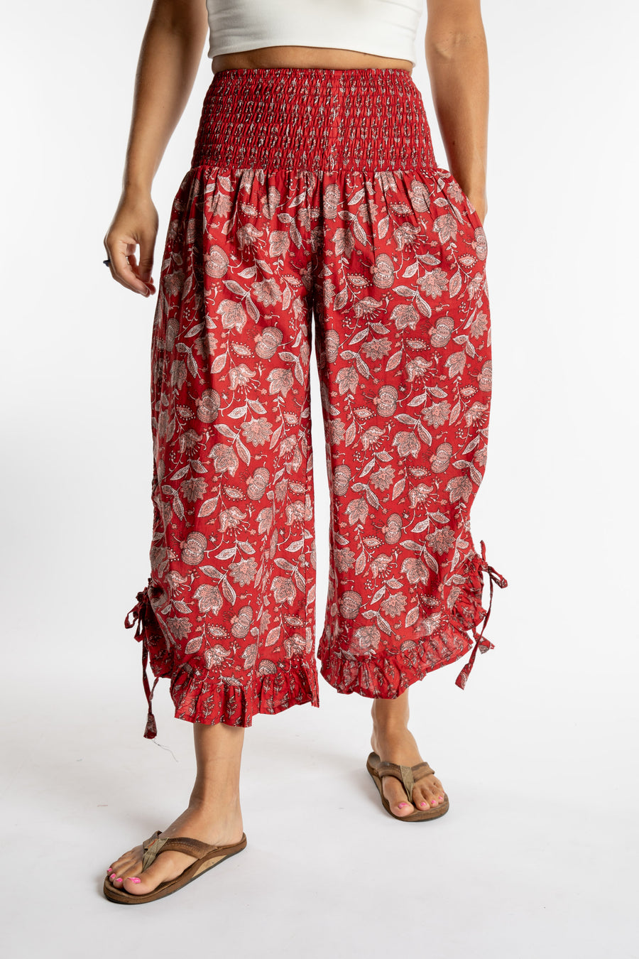 Sophie is wearing the Kiraana Tonal Crop Pants in Red S/M