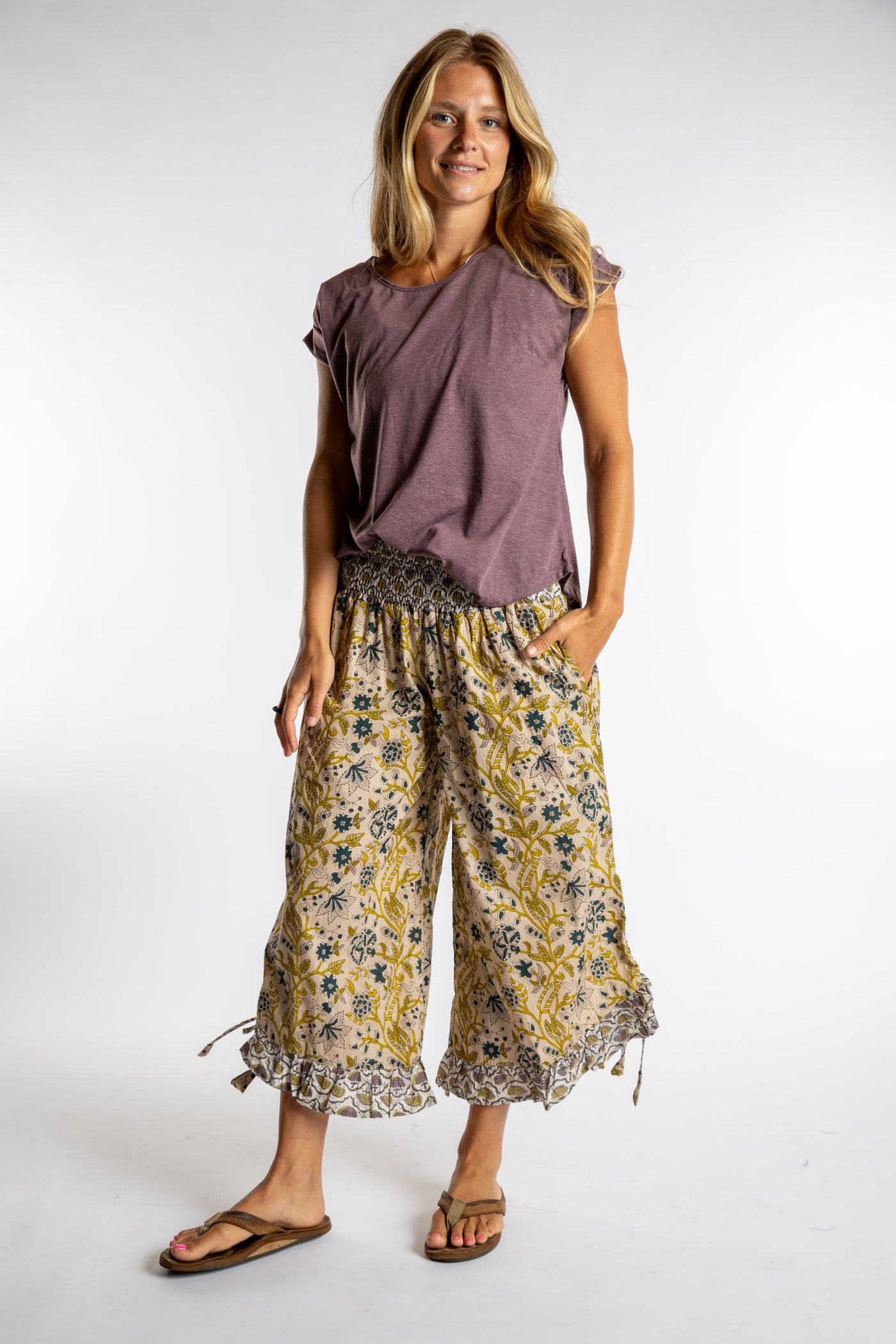 Sophie is wearing the Kiraana Tonal Crop Pants in Tan S/M