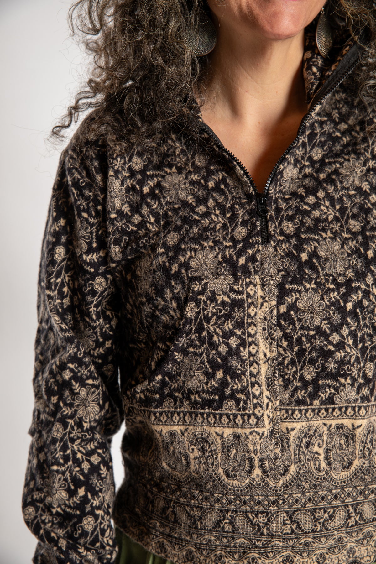 Susan is wearing the M/L Kiran Soft Brushed Quarter Zip Pullover in Black 