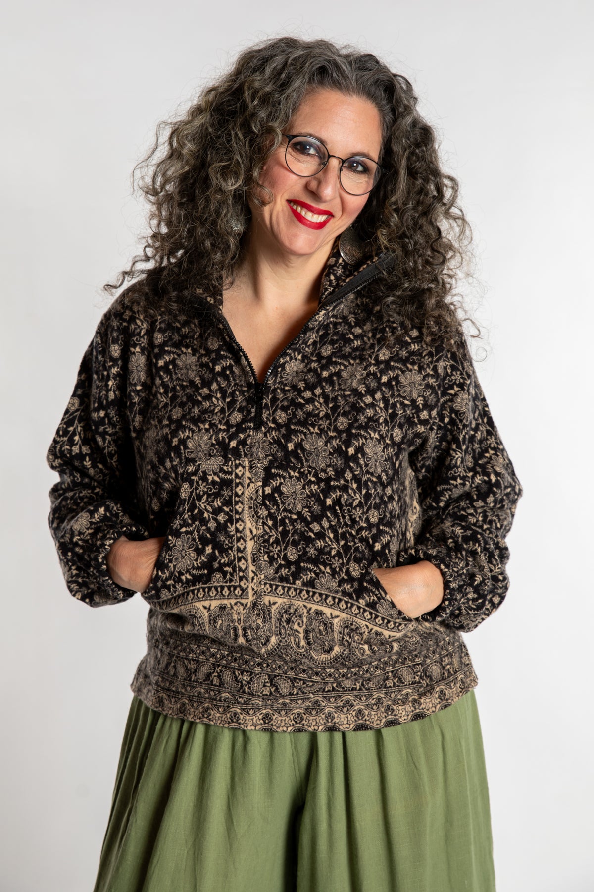 Susan is wearing the M/L Kiran Soft Brushed Quarter Zip Pullover in Black 