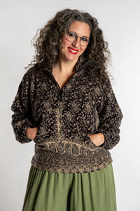 Susan is wearing the M/L Kiran Soft Brushed Quarter Zip Pullover in Black 