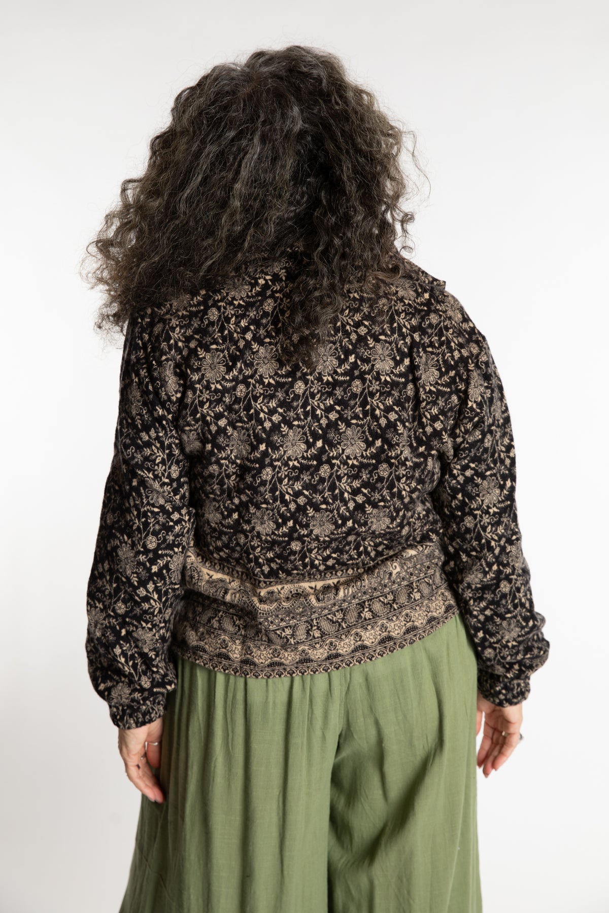 Susan is wearing the M/L Kiran Soft Brushed Quarter Zip Pullover in Black 