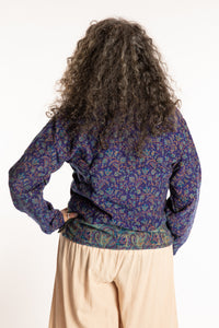 Susan is wearing the M/L Kiran Soft Brushed Quarter Zip Pullover in Blue