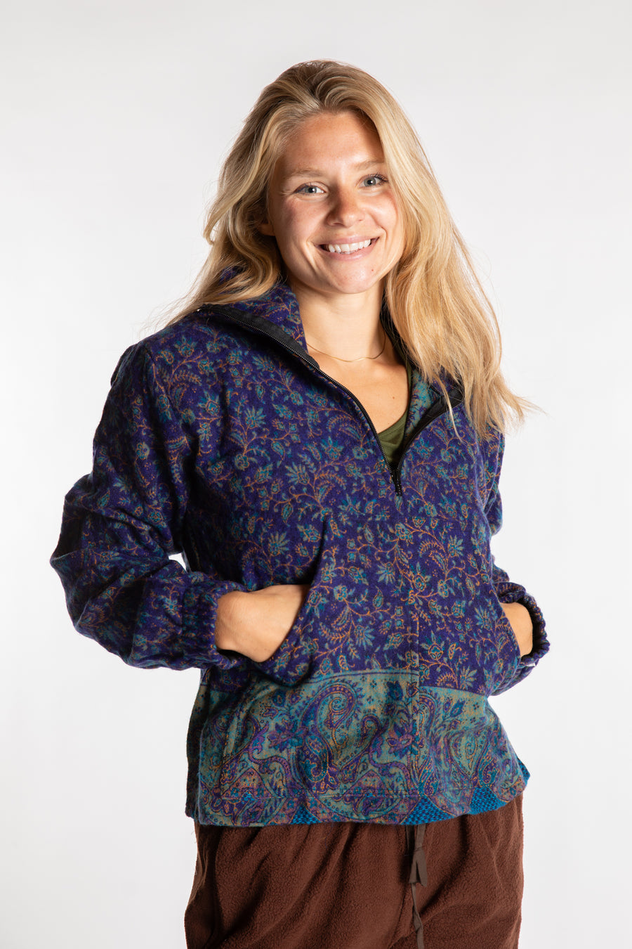 Susan is wearing the S/M Kiran Soft Brushed Quarter Zip Pullover in Blue