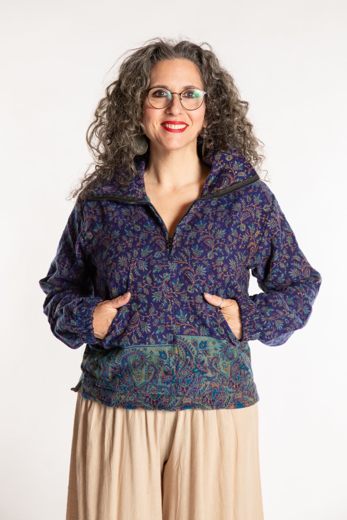 Susan is wearing the M/L Kiran Soft Brushed Quarter Zip Pullover in Blue