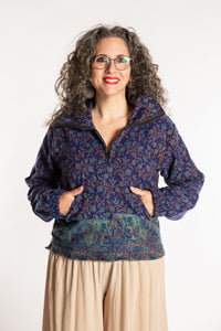 Susan is wearing the M/L Kiran Soft Brushed Quarter Zip Pullover in Blue