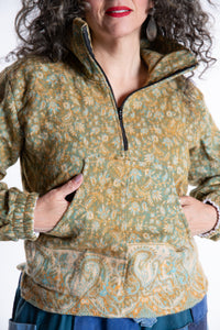 Susan is wearing the M/L Kiran Soft Brushed Quarter Zip Pullover in Green