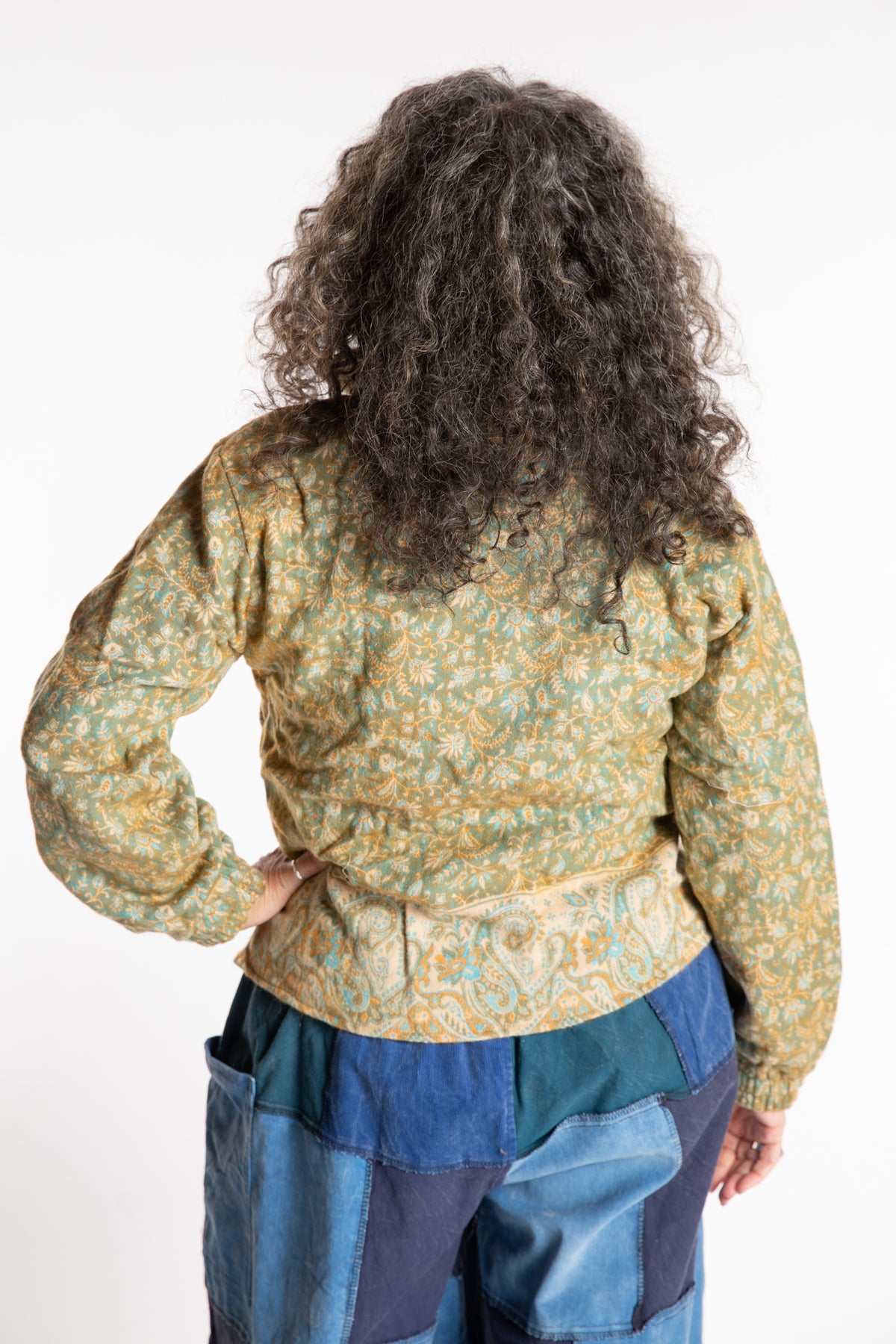 Susan is wearing the M/L Kiran Soft Brushed Quarter Zip Pullover in Green
