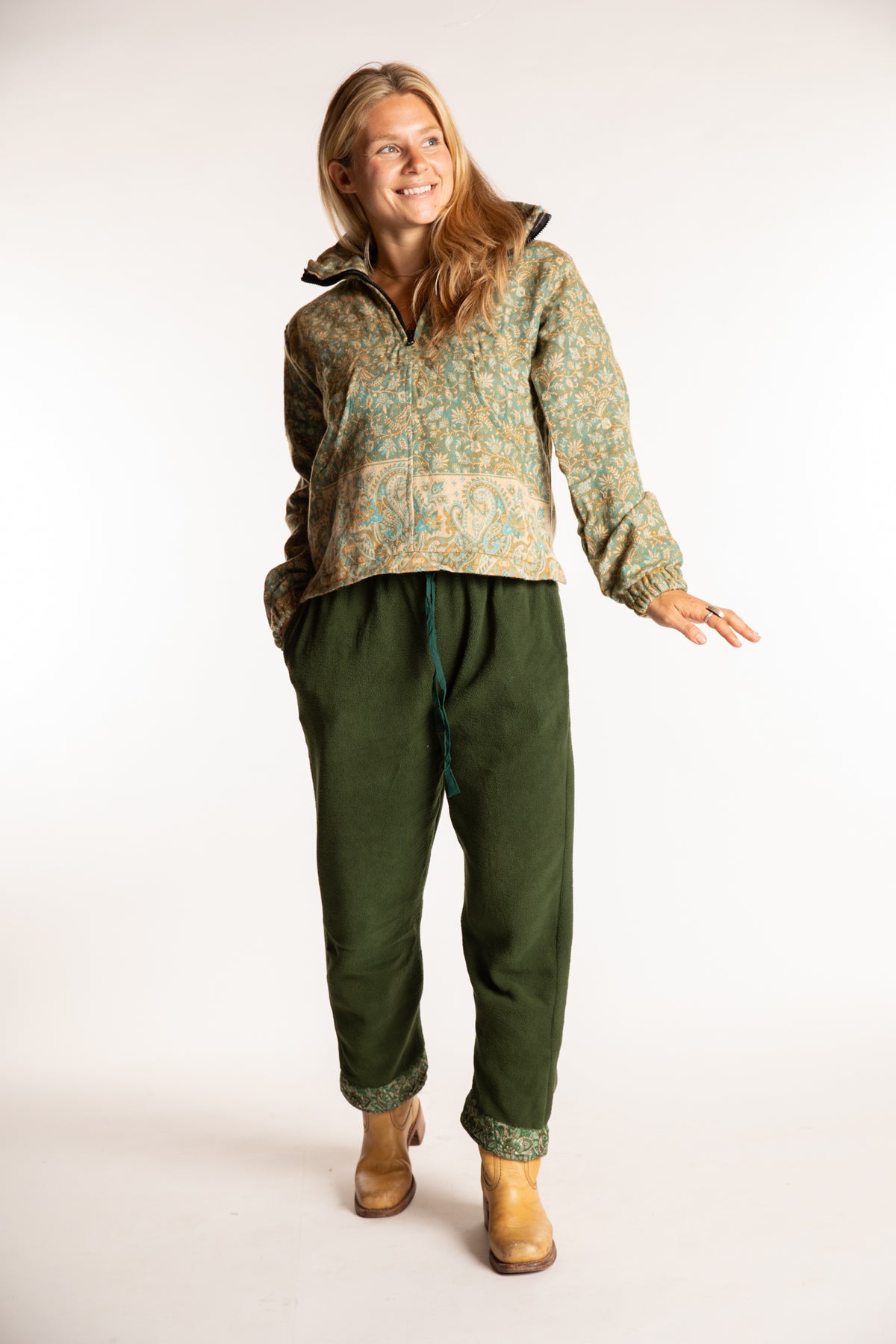 Sophie is wearing the S/M Kiran Soft Brushed Quarter Zip Pullover in Green
