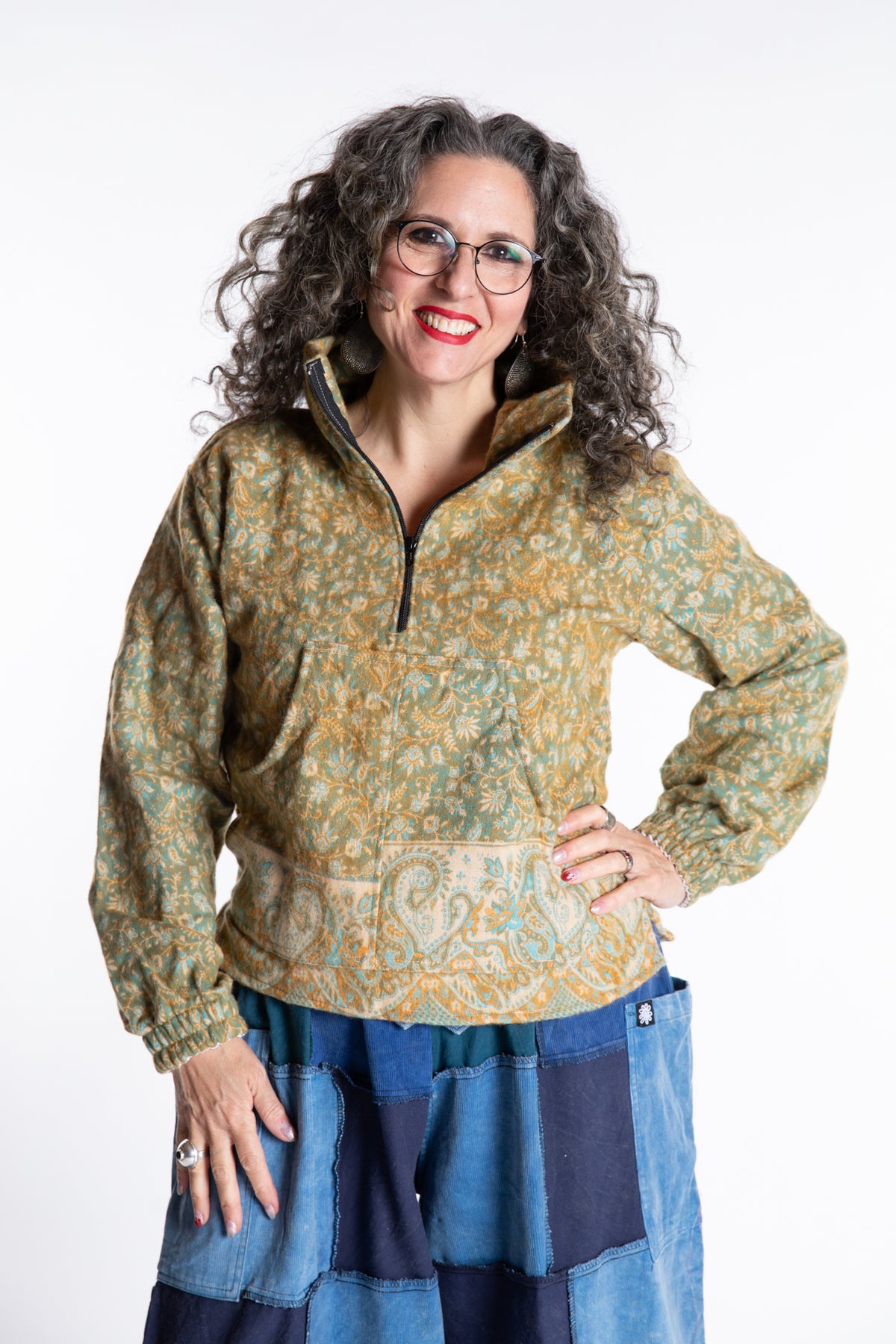 Susan is wearing the M/L Kiran Soft Brushed Quarter Zip Pullover in Green