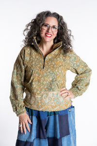 Susan is wearing the M/L Kiran Soft Brushed Quarter Zip Pullover in Green