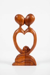 Kissing carved wooden sculpture
