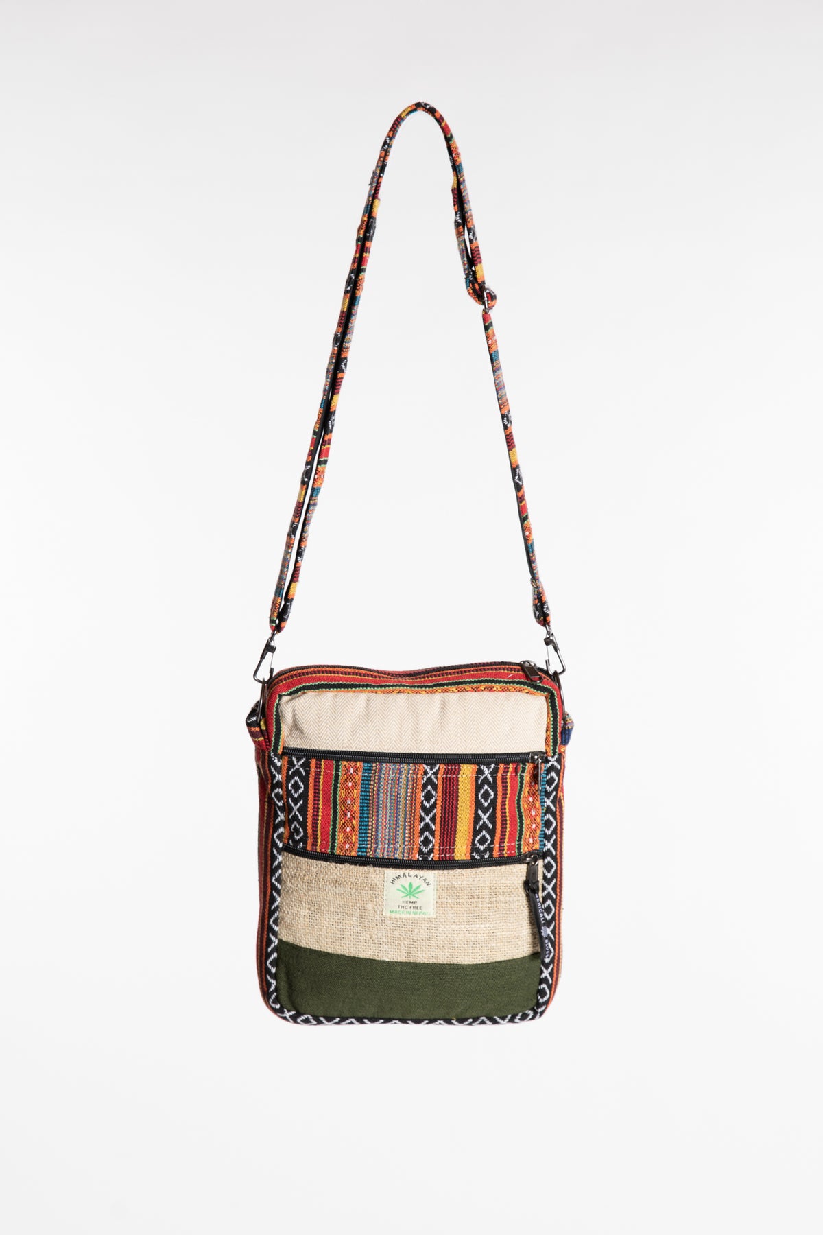 Koshi hemp patchwork crossbody bag with colorful striped panel, cream fabric and green accents