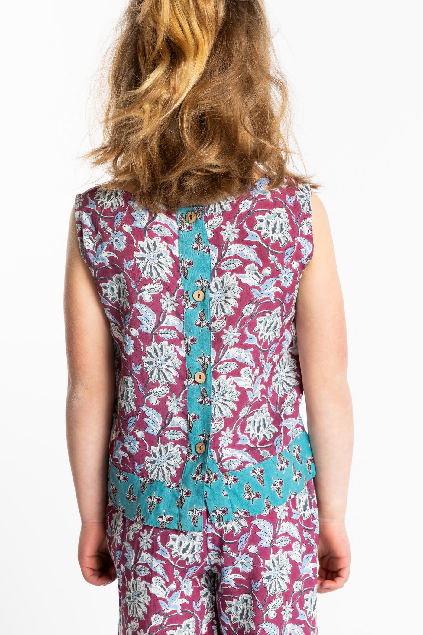 Louisa age 7 wearing size Small Sahana Contrast Hem Kids Top in burgundy floral print