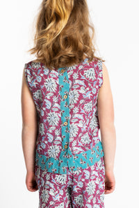 Louisa age 7 wearing size Small Sahana Contrast Hem Kids Top in burgundy floral print