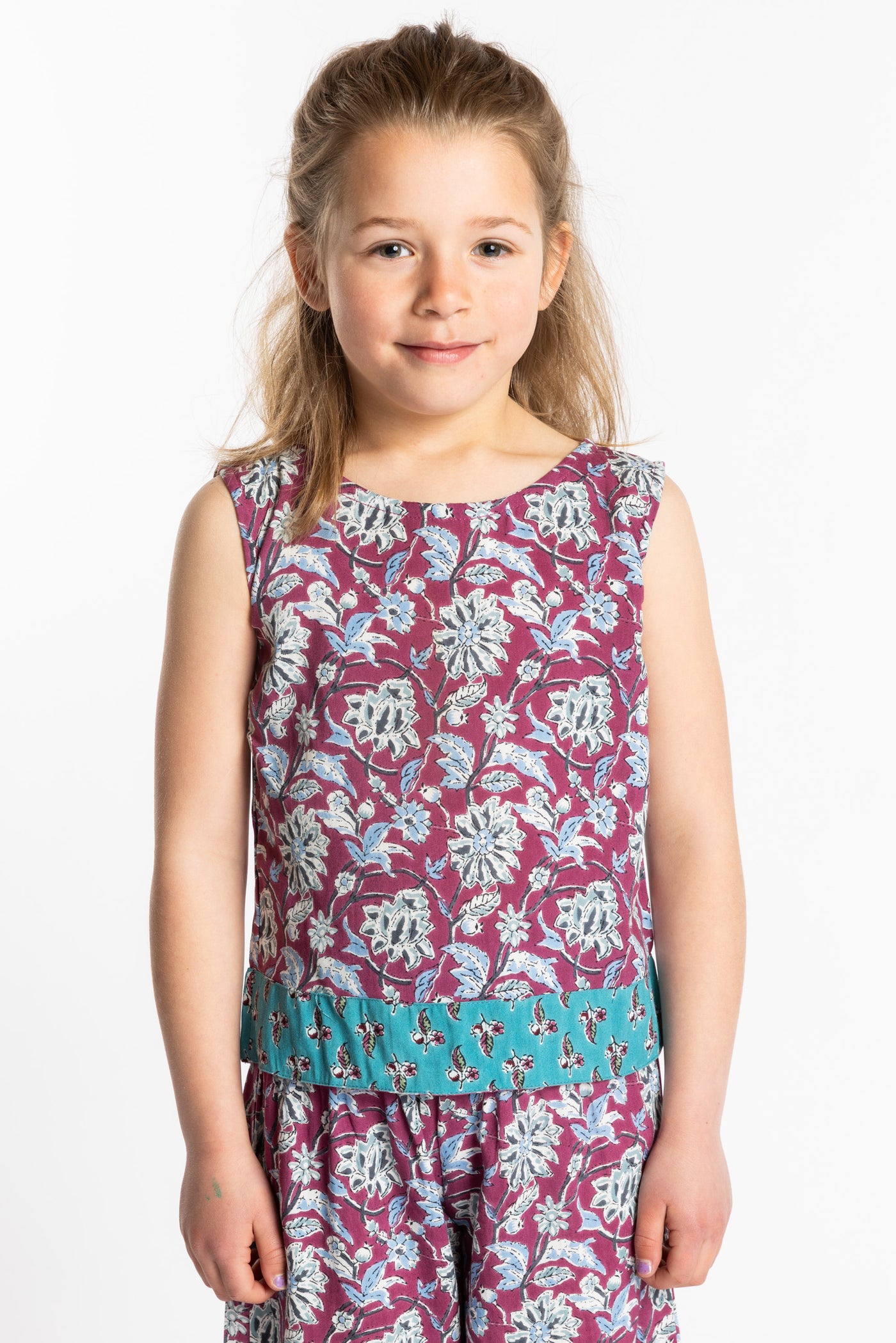 Louisa age 7 wearing size Small Sahana Contrast Hem Kids Top in burgundy floral print